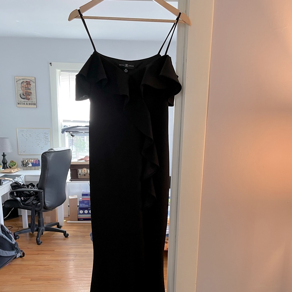 Long black maxi dress from Betsy Adams with leg slit.